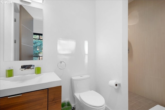 bathroom with vanity and toilet