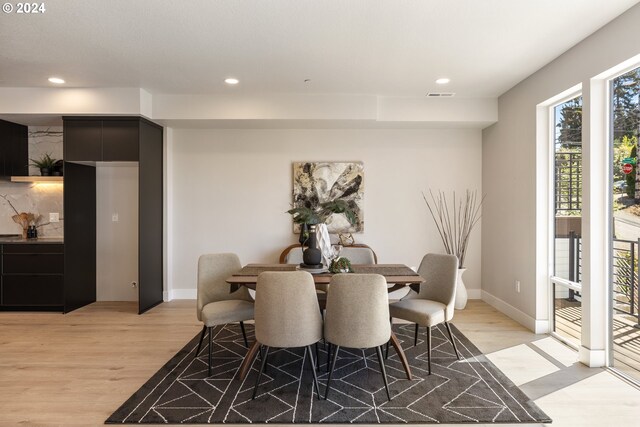 dining area with light hardwood / wood-style flooring