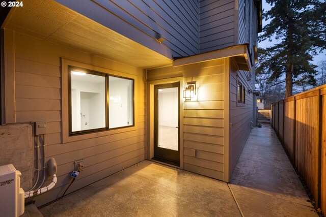 property entrance featuring a patio area