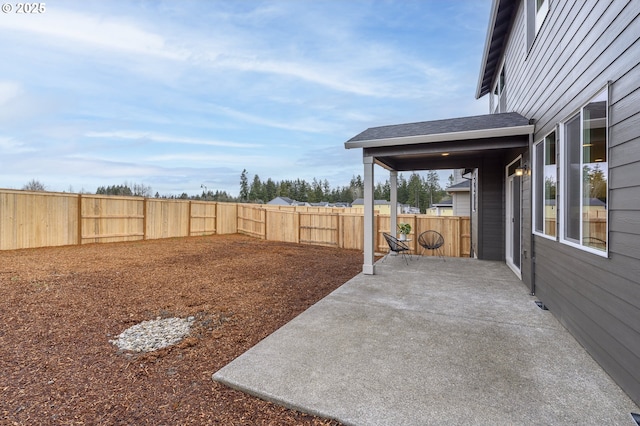 view of yard with a patio and a fenced backyard