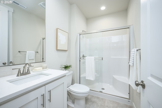 full bath with visible vents, toilet, a stall shower, recessed lighting, and vanity