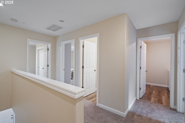 hallway with light carpet