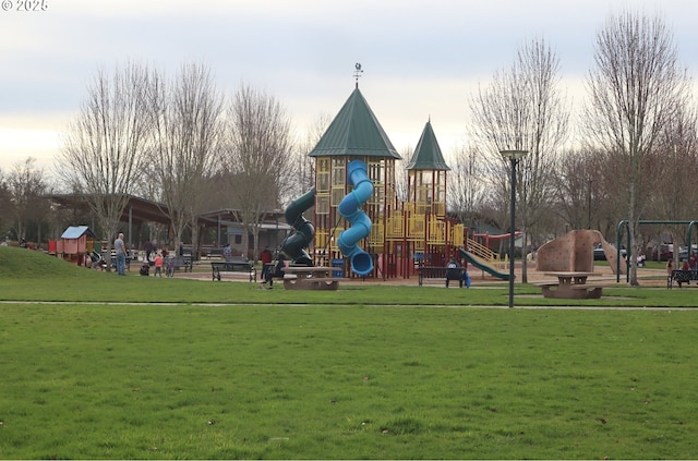 community playground featuring a lawn