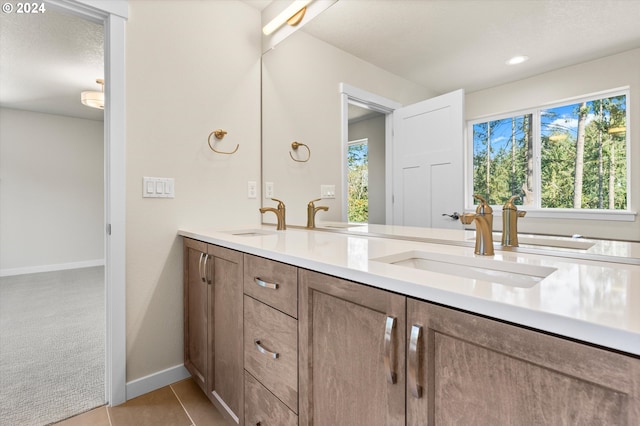 bathroom with vanity, tile patterned flooring, and a textured ceiling