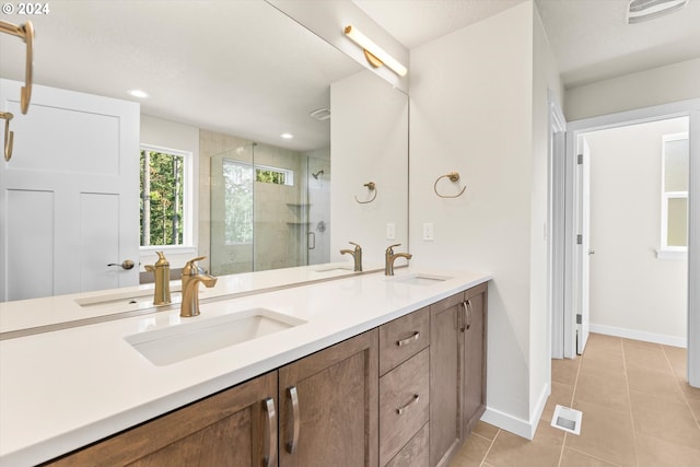 bathroom with vanity, tile patterned floors, and an enclosed shower