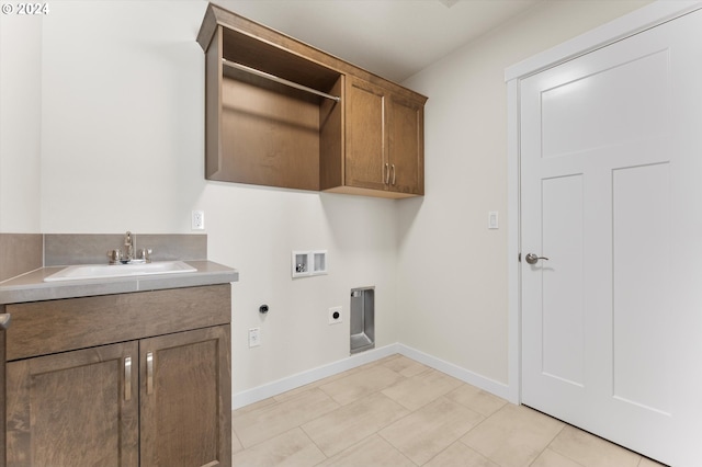 laundry room with washer hookup, light tile patterned flooring, sink, hookup for an electric dryer, and cabinets