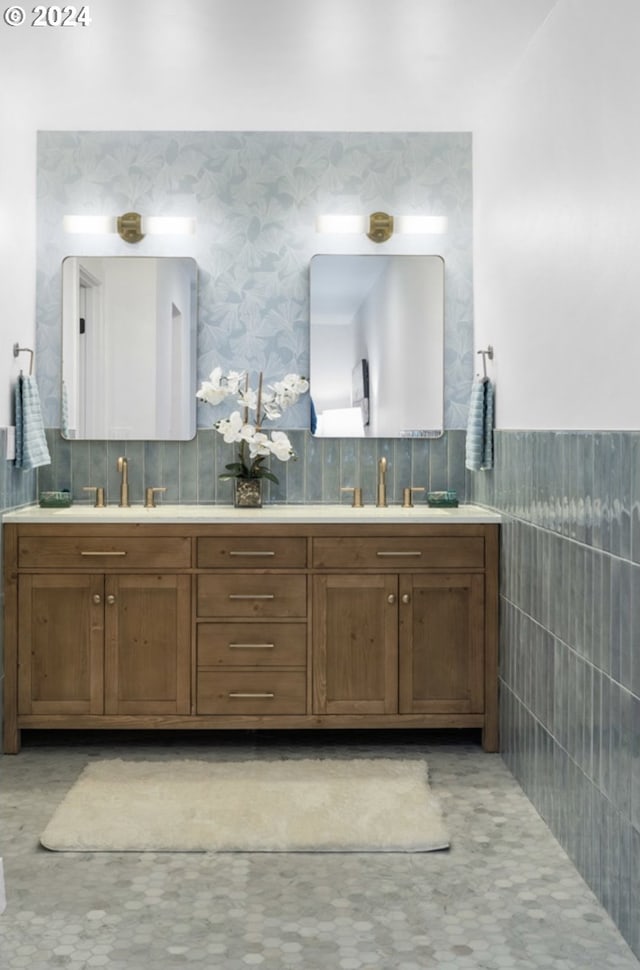 bathroom featuring tile walls and vanity