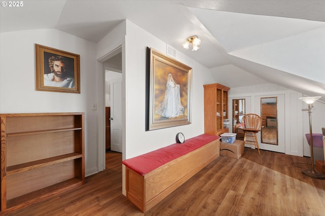 interior space with dark wood-style floors and vaulted ceiling