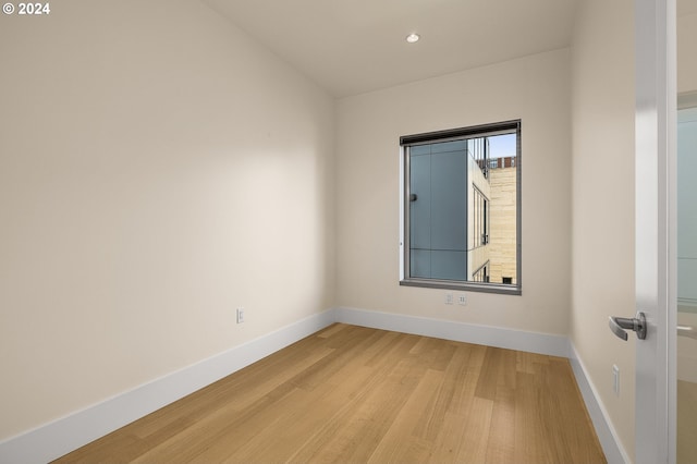 unfurnished room featuring light hardwood / wood-style flooring