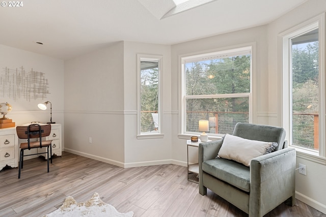 living area with light hardwood / wood-style flooring