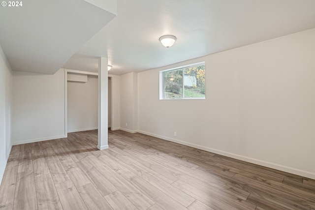 basement featuring light hardwood / wood-style floors