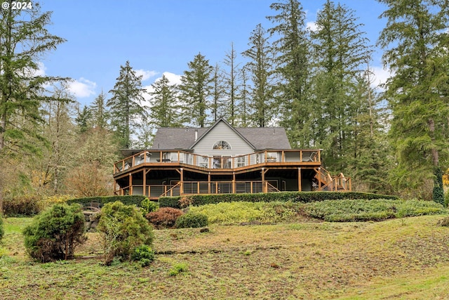 back of property with a wooden deck