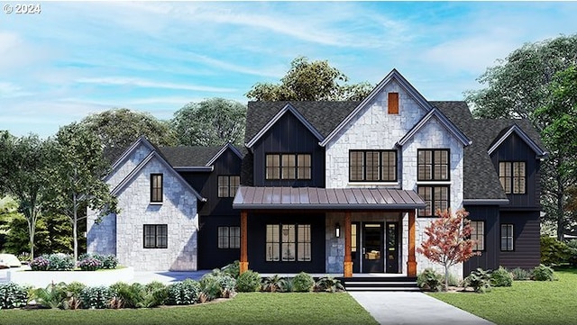 view of front of house featuring stone siding, a front lawn, a standing seam roof, and a porch