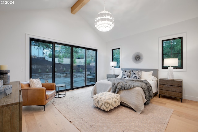 bedroom featuring beam ceiling, light hardwood / wood-style floors, access to exterior, high vaulted ceiling, and a chandelier