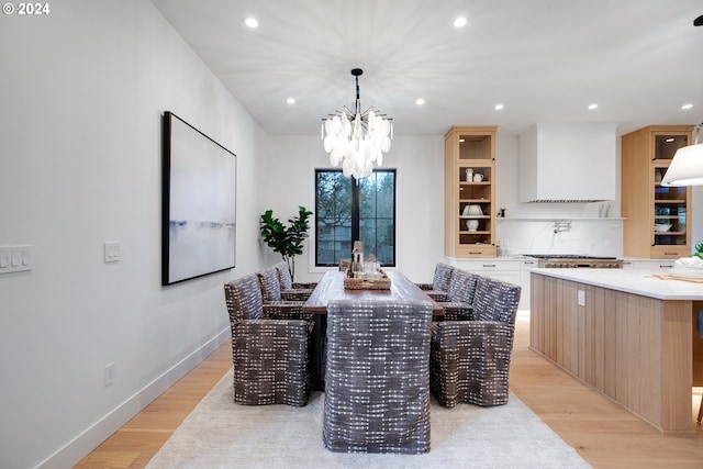 dining room featuring a chandelier and light hardwood / wood-style floors