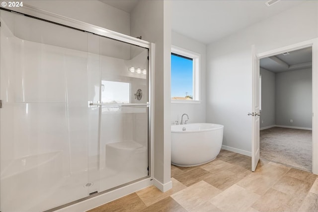 bathroom with separate shower and tub