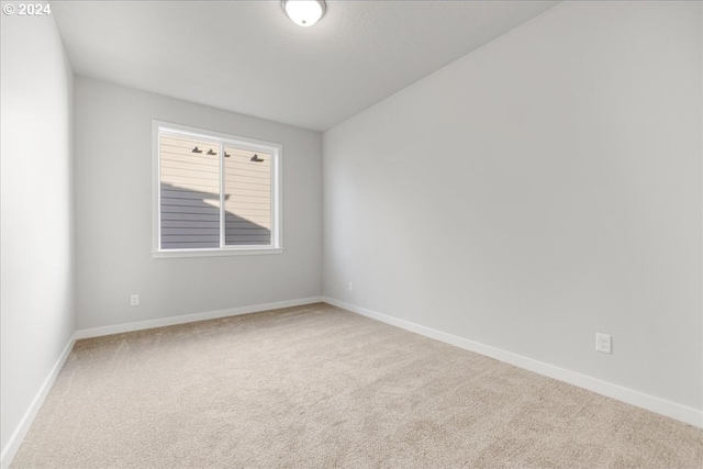 unfurnished room with carpet flooring