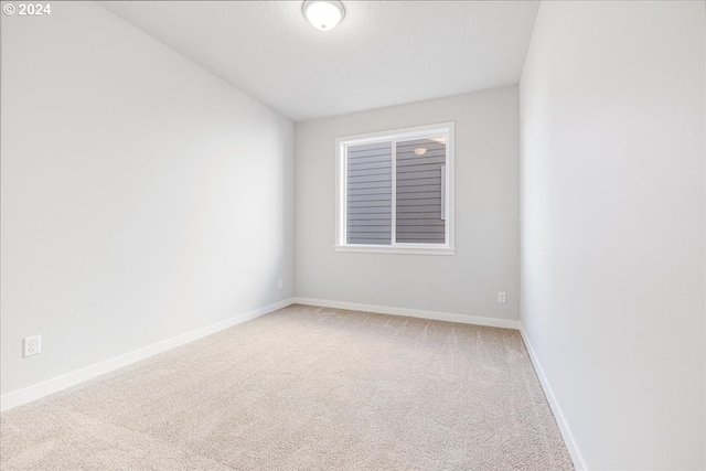 empty room with carpet flooring