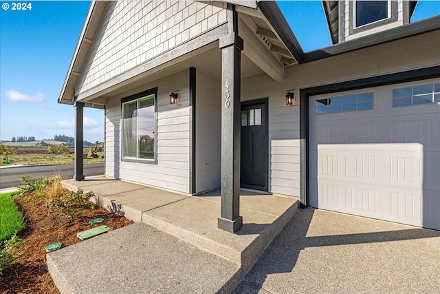 view of exterior entry featuring a garage