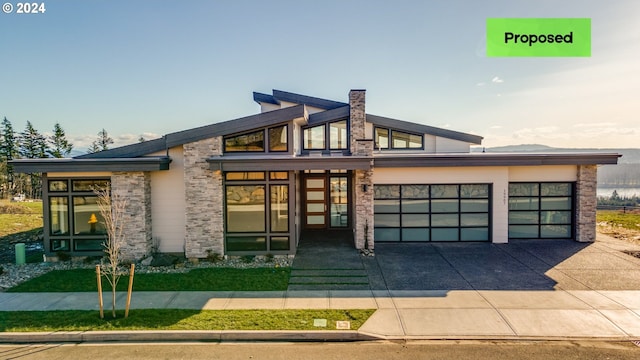 view of front of property featuring a front lawn and a garage