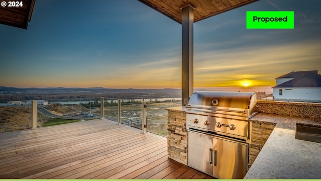 deck at dusk featuring grilling area and area for grilling