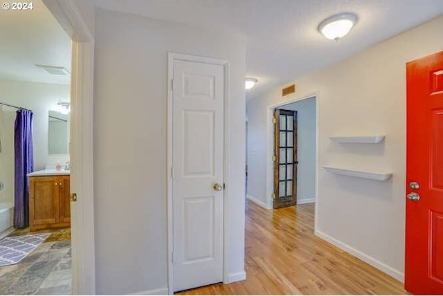 hall featuring light wood-type flooring