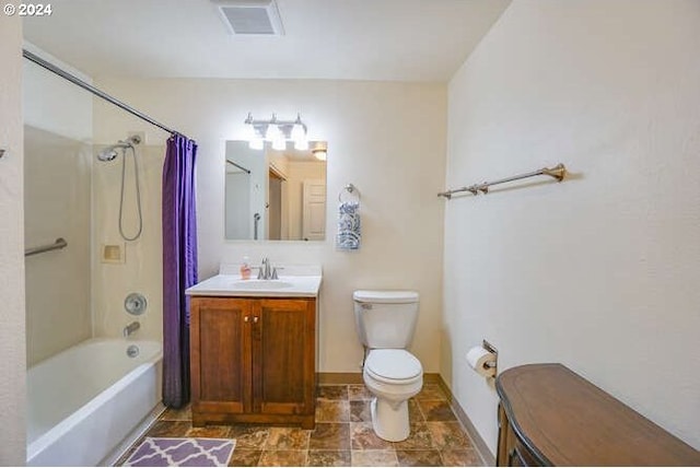 full bathroom featuring vanity, toilet, and shower / bath combo with shower curtain