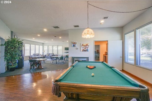 playroom with hardwood / wood-style flooring, a textured ceiling, and pool table