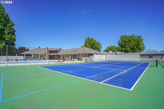 view of tennis court with basketball court