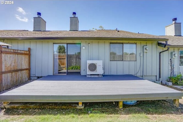 back of property featuring ac unit and a deck