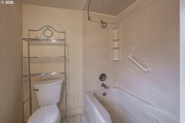 bathroom featuring toilet and tiled shower / bath combo