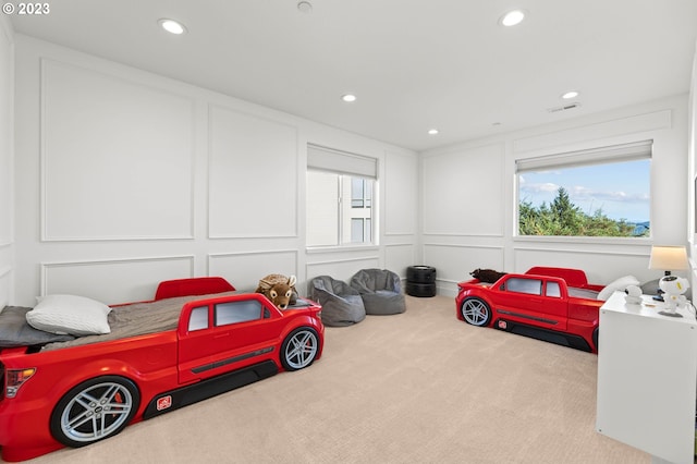 bedroom with light colored carpet