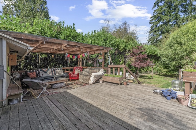 wooden terrace with outdoor lounge area