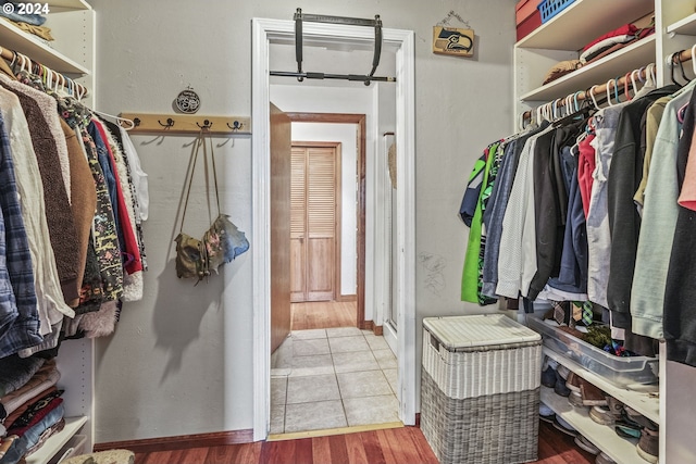 walk in closet featuring hardwood / wood-style flooring