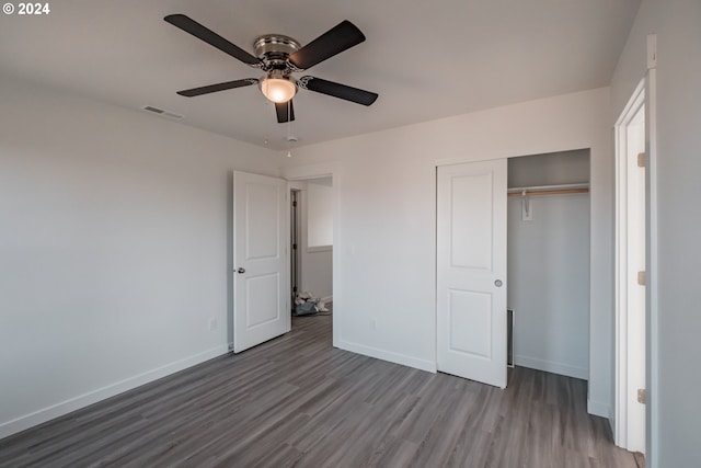 unfurnished bedroom featuring ceiling fan, a closet, and light hardwood / wood-style floors