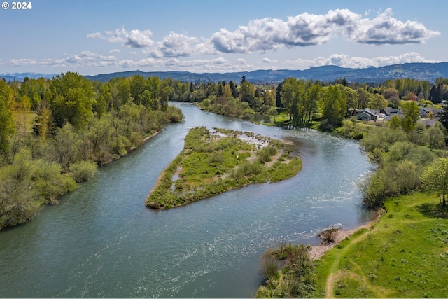 bird's eye view with a water and mountain view