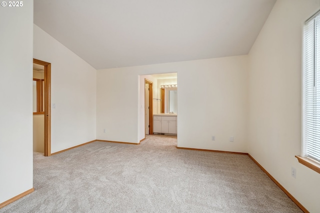 4135 SW Brugger St, Portland, OR 97219 - unfurnished room with vaulted ceiling, light colored carpet, and healthy amount of natural light