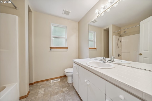 4135 SW Brugger St, Portland, OR 97219 - bathroom with vanity, stone finish floors, and shower / tub combination