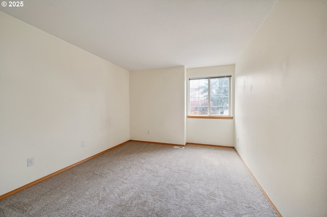 4135 SW Brugger St, Portland, OR 97219 - empty room featuring carpet flooring and baseboards
