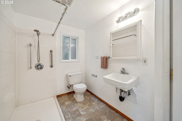 4135 SW Brugger St, Portland, OR 97219 - full bathroom with tiled shower and stone finish floors