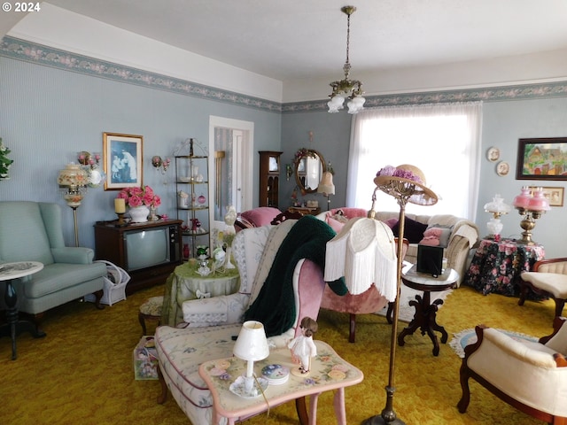 living room with carpet floors and a chandelier