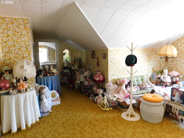 interior space with carpet floors and vaulted ceiling