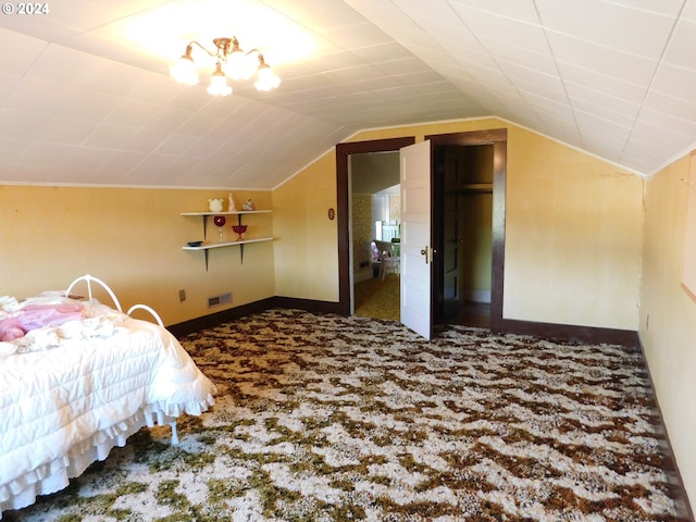 carpeted bedroom with vaulted ceiling and a closet