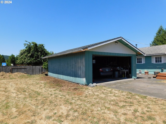 view of home's exterior with a yard and a garage