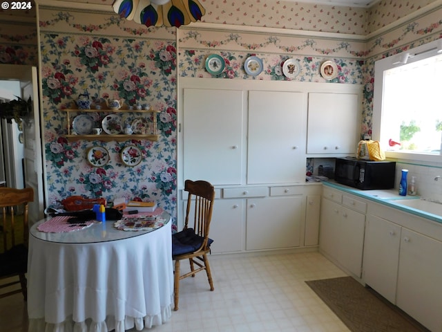 kitchen with white cabinets and sink