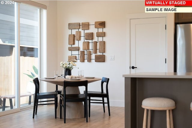 dining room with light hardwood / wood-style flooring