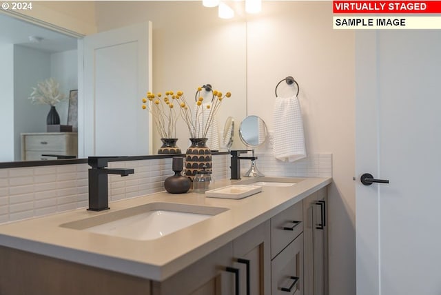 bathroom with decorative backsplash and vanity