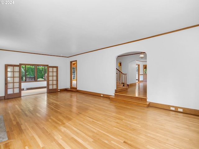 unfurnished room featuring crown molding and light hardwood / wood-style flooring