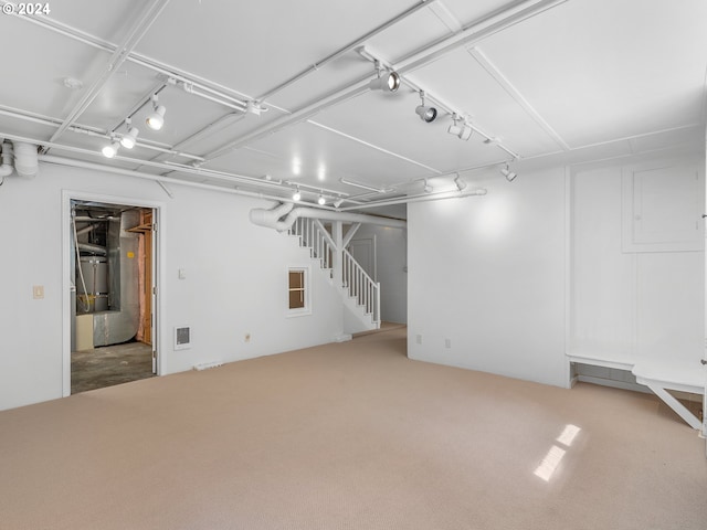 basement featuring carpet flooring