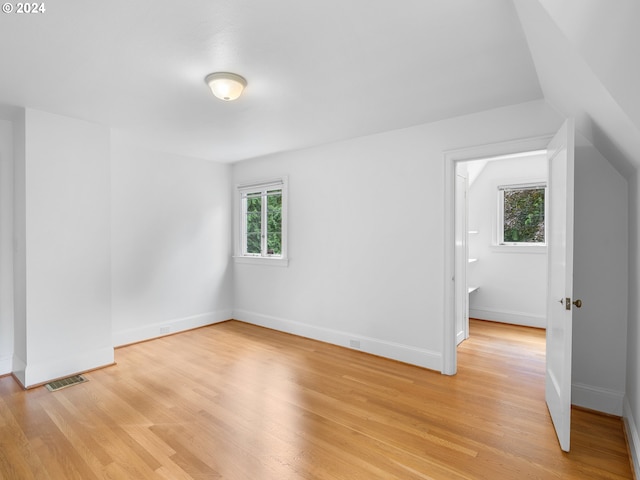 interior space with light wood-type flooring and a healthy amount of sunlight